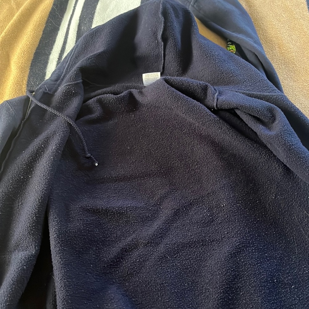 Blue Ron Jon jacket with parrot and island design size medium in women’s